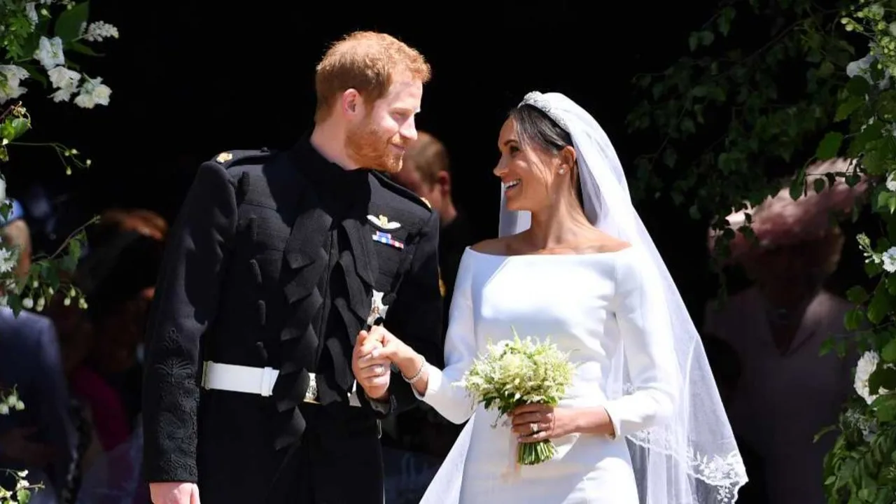 Prince Harry, Duke of Sussex and his wife Meghan, Duchess of Sussex leave from the West Door of St George's Chapel, Windsor Castle, in Windsor on May 19, 2018 in Windsor, England. (Cover Image Source: Getty Images | Ben Stansall/WPA Pool)