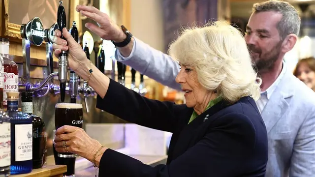 In Photos: Queen Camilla Looks Really Proud Of Herself After She Pours the Perfect Pint