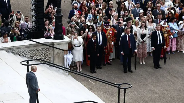 King Charles Braves The Rain For A Solo Appearance at Palace Garden Party [Photos]