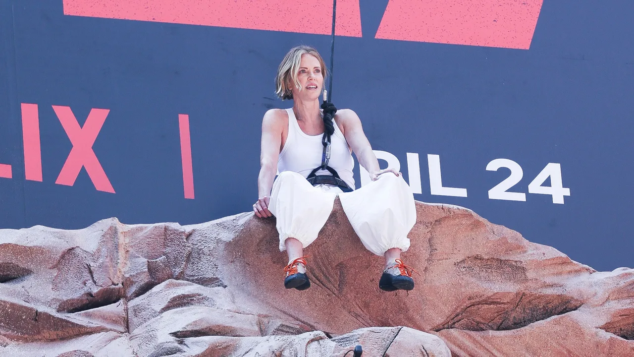 Charlize Theron scales NYC billboard in high-octane stunt for ‘Apex’ promo