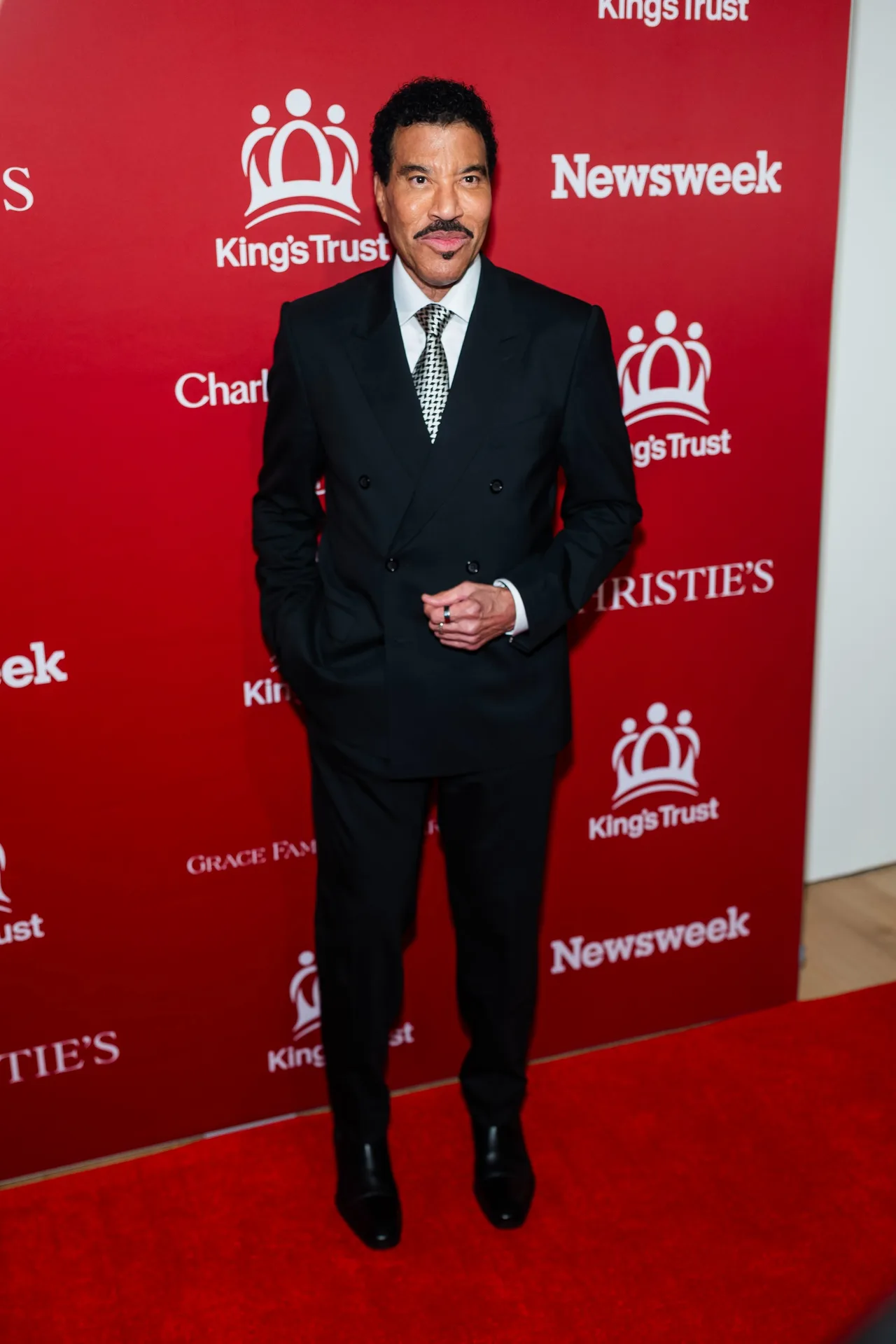 Lionel Richie embraces a formal and sophisticated look