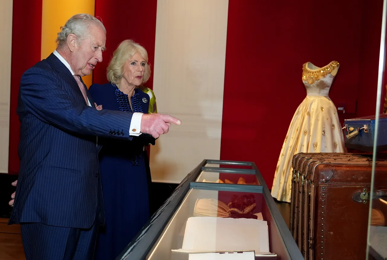 King Charles examines craftsmanship and detail