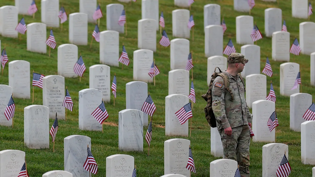 Fallen Heroes Remembered: Soldiers place flags at every grave in Arlington National Cemetery ahead of Memorial Day