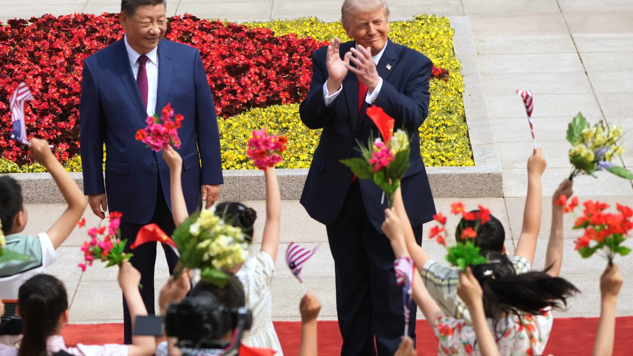 Trump gets grand welcome in Beijing as students wave US flags