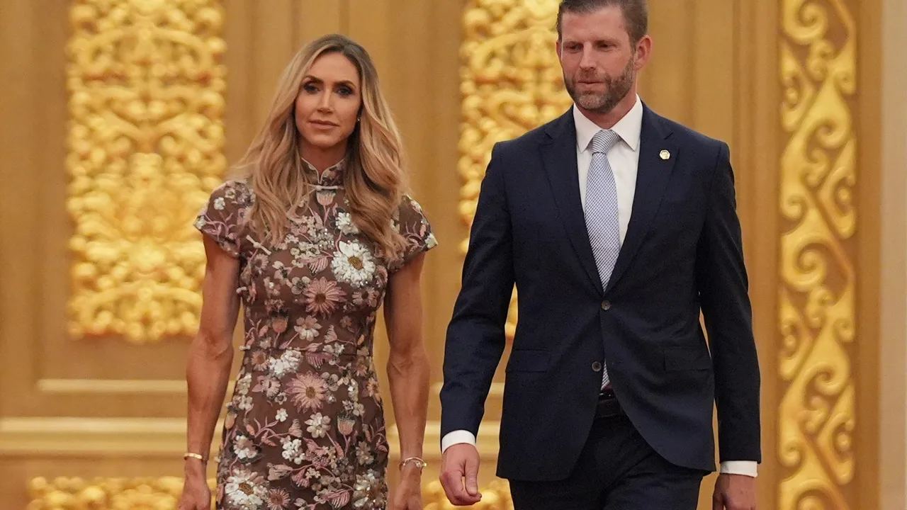 Eric Trump, right, and wife Lara arrives at a state dinner for President Donald Trump and Chinese President Xi Jinping at the Great Hall of the People on Thursday May 14, 2026, in Beijing. (AP Photo/Mark Schiefelbein)