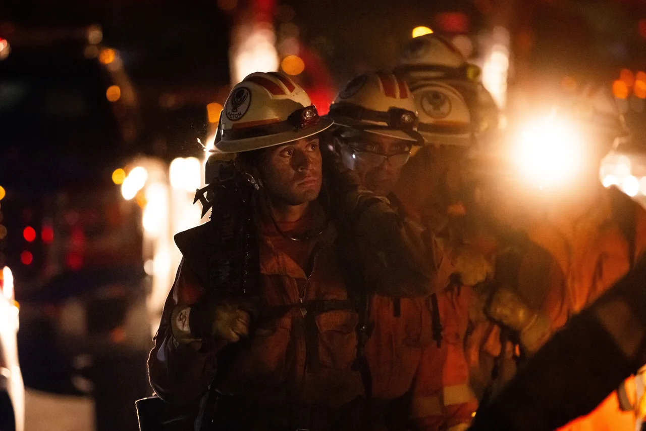 Inmate crews hike while battling the Sandy Fire