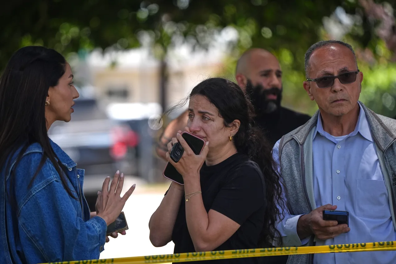 Mourners Embrace Outside San Diego Islamic Center