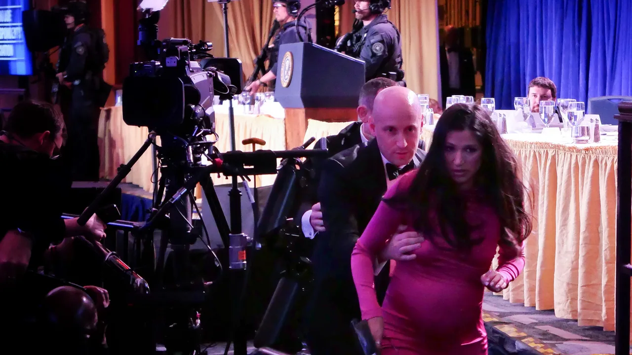 White House Deputy Chief of Staff for Policy Stephen Miller helps his wife Katie Miller after an incident at the annual White House Correspondents Association Dinner April 25, 2026 in Washington, DC (Photo by Chip Somodevilla/Getty Images)