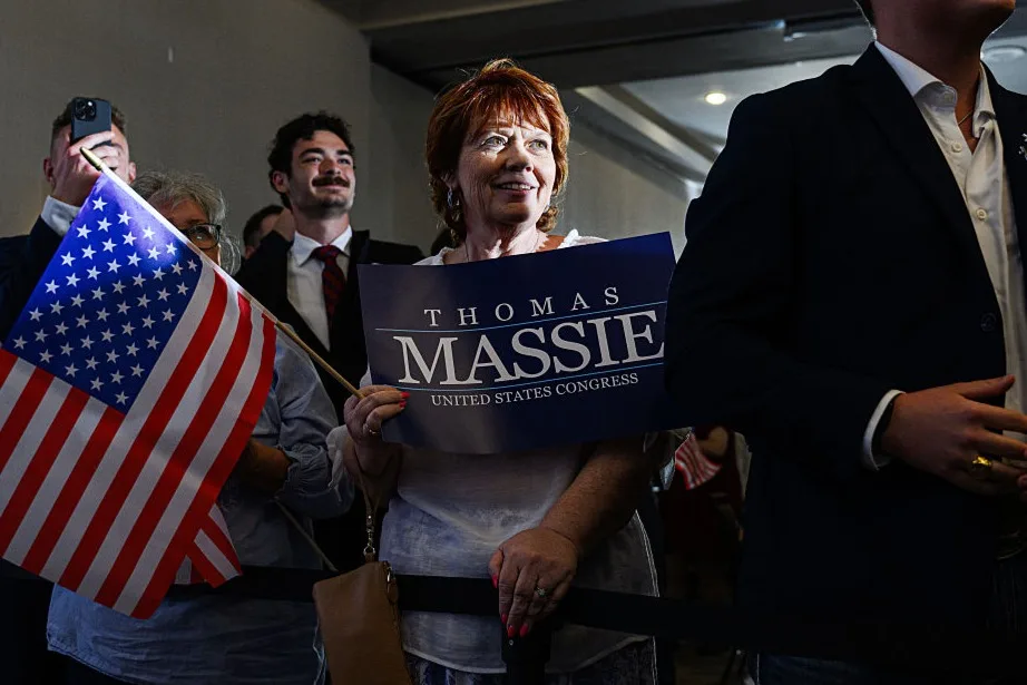 Supporters stand during an election night watch party for Rep. Thomas Massie