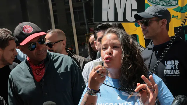 Tom Morello rallies protesters at anti-ICE march as ‘Hands Off’ signs flood NYC streets