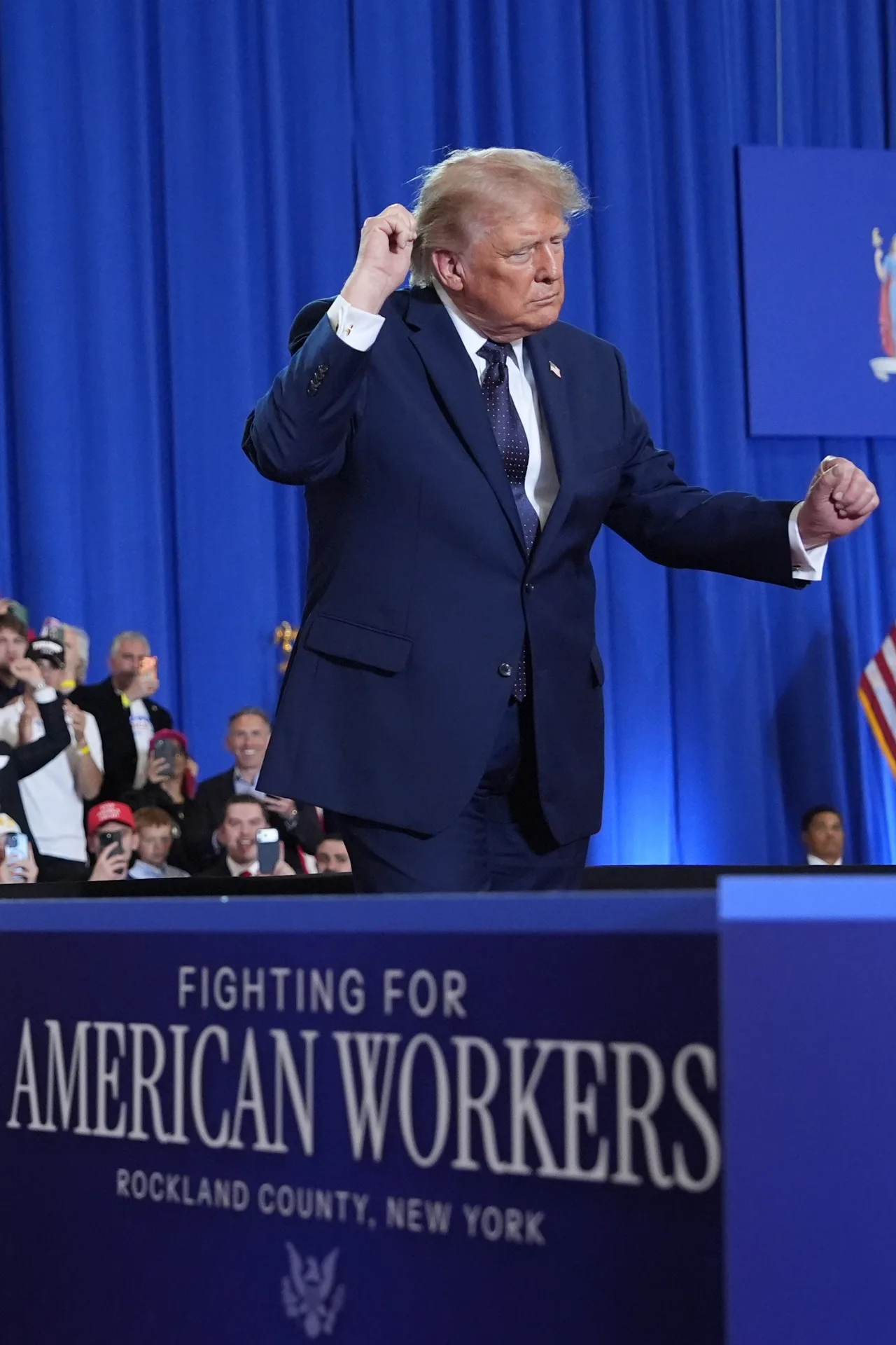 Trump works the crowd as music plays on