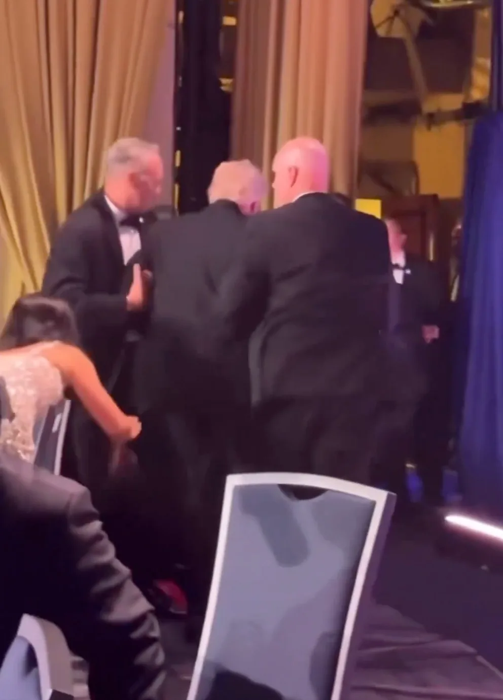 Trump taken off stage