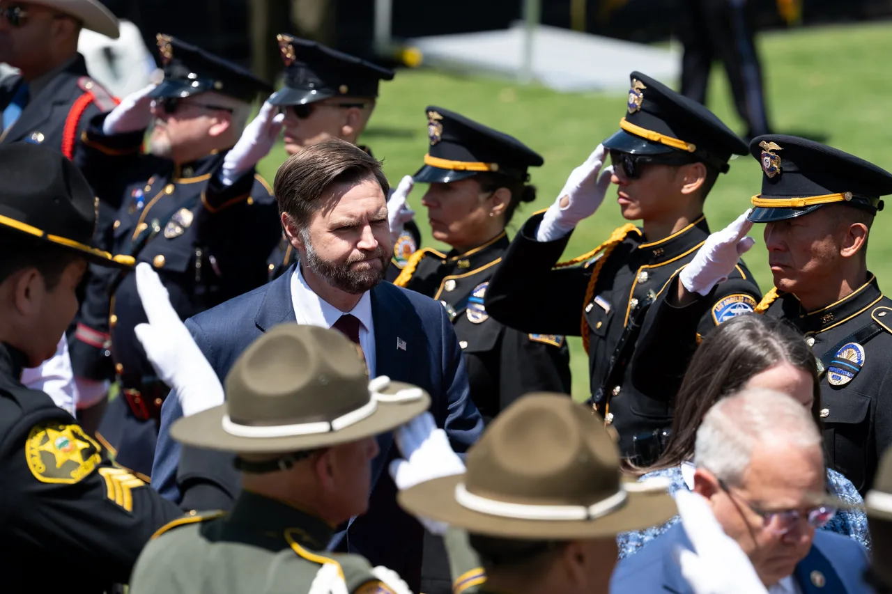 JD Vance walks through saluting officers at memorial ceremony