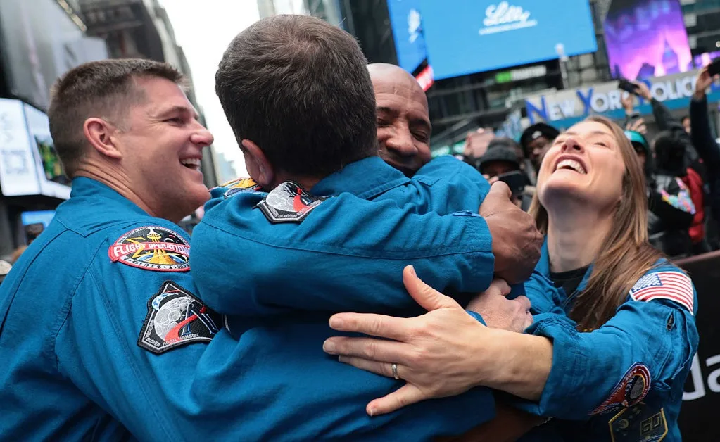 Nothing like a good group hug—Artemis II astronauts embrace outside Nasdaq Marketside