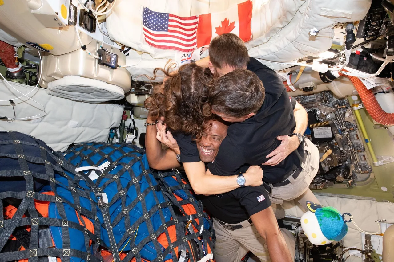 Group hug of Artemis II crew