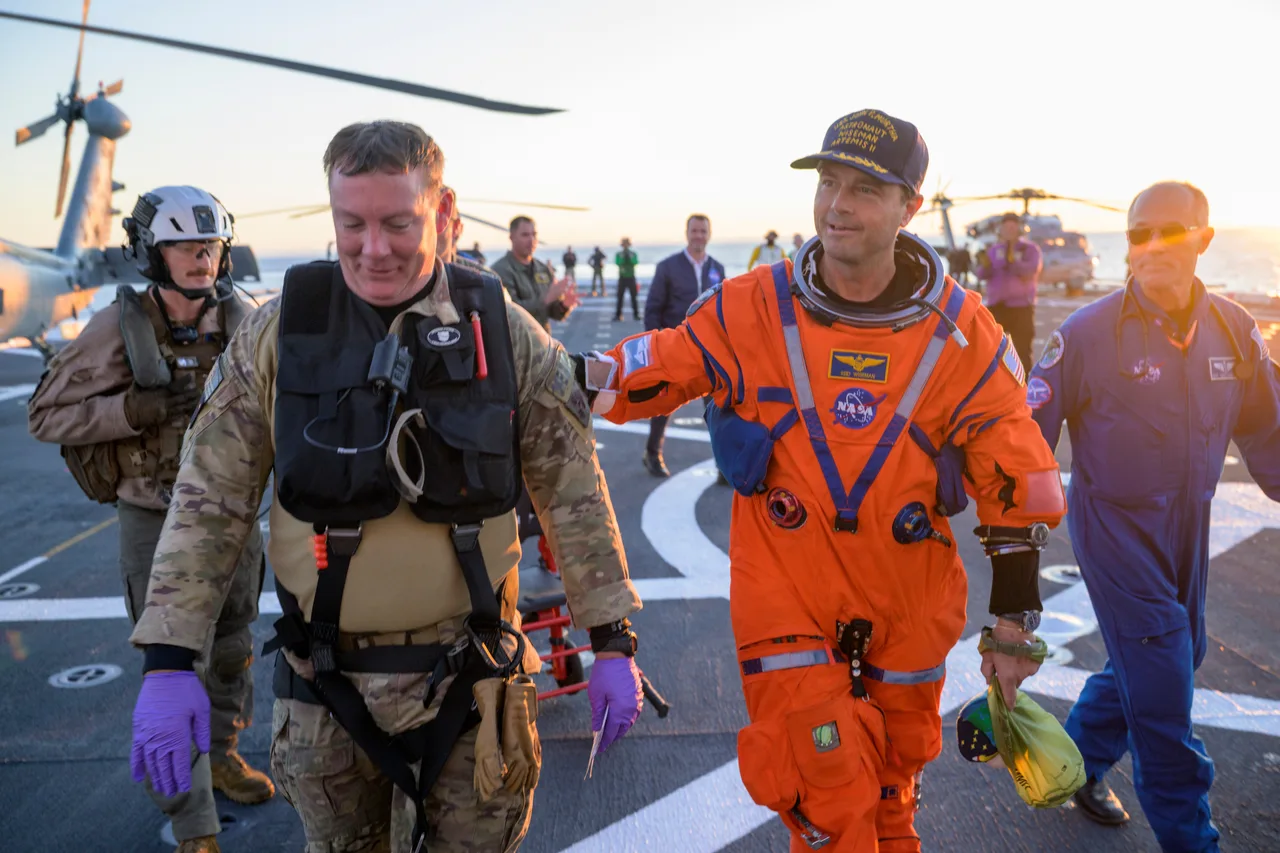 Reid Wiseman with US Navy personnel