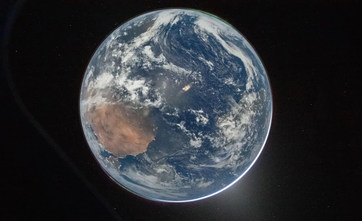 Earth shining bright as Orion moved towards the Moon