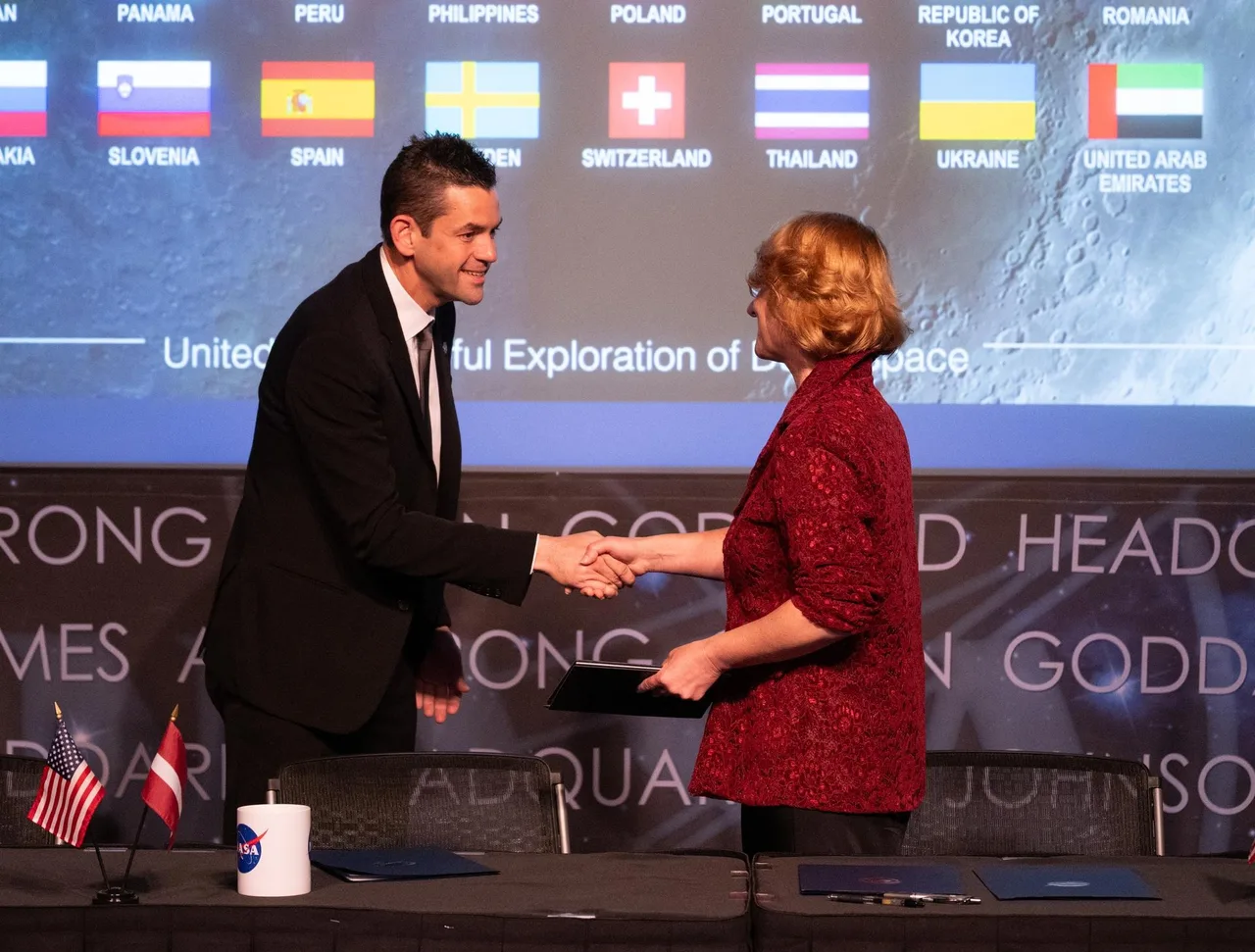 NASA Administrator Jared Isaacman (left), shakes hands with Dace Melbārde, Latvia’s Minister for Education and Science