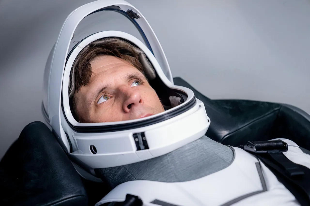 Canadian Joshua Kutryk seen seated in Dragon capsule