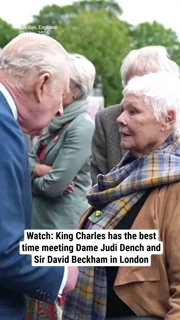 Watch: King Charles has the best time meeting Dame Judi Dench and Sir David Beckham in London
