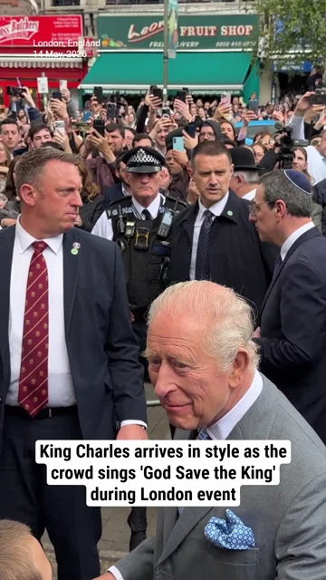 King Charles arrives in style as the crowd sings 'God Save the King' during London event