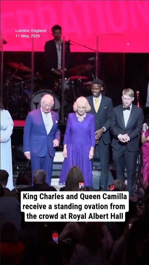King Charles and Queen Camilla receive a standing ovation from the crowd at Royal Albert Hall