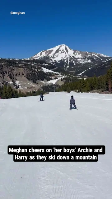 Meghan cheers on 'her boys' Archie and Harry as they ski down a mountain