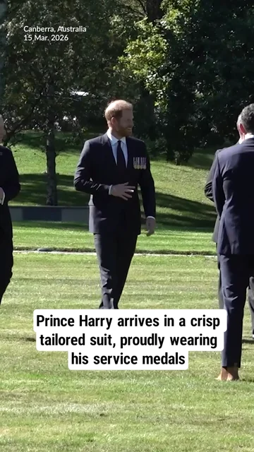 Prince Harry arrives in a crisp tailored suit, proudly wearing his service medals