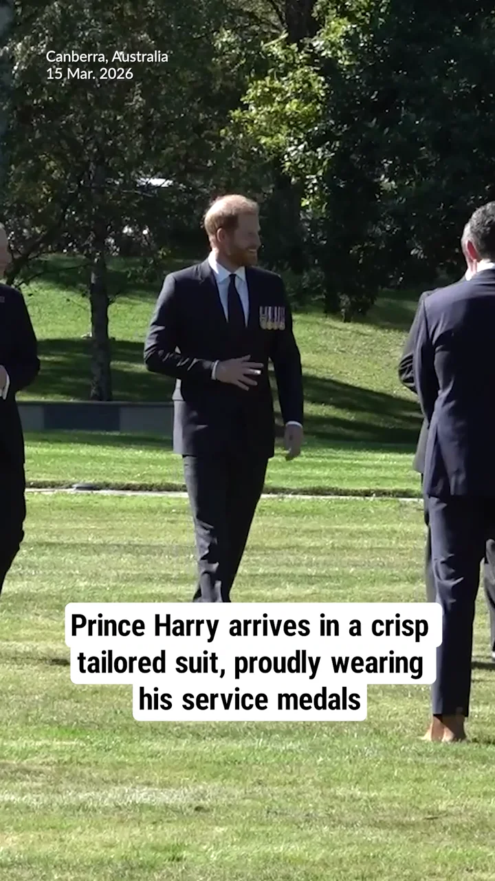 Prince Harry arrives in a crisp tailored suit, proudly wearing his service medals