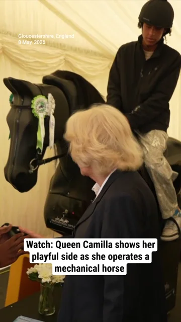 Watch: Queen Camilla shows her playful side as she operates a mechanical horse during royal outing