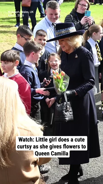 Watch: Little girl does a cute curtsy as she gives flowers to Queen Camilla