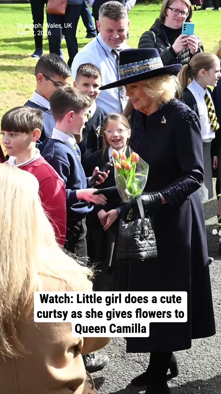 Watch: Little girl does a cute curtsy as she gives flowers to Queen Camilla