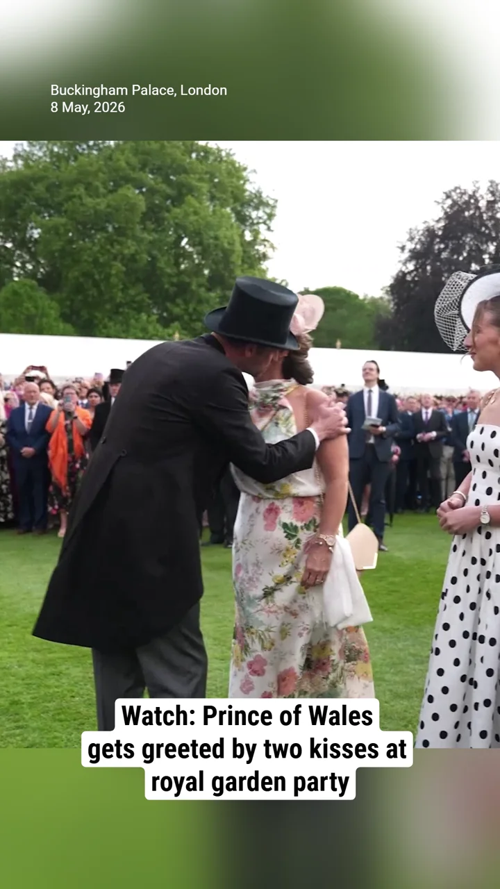 Watch: Prince of Wales gets greeted by two kisses at royal garden party