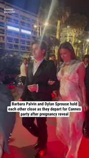 Barbara Palvin and Dylan Sprouse hold each other close as they depart for Cannes party after pregnancy reveal