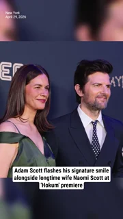Adam Scott flashes his signature smile alongside longtime wife Naomi Scott at 'Hokum' premiere