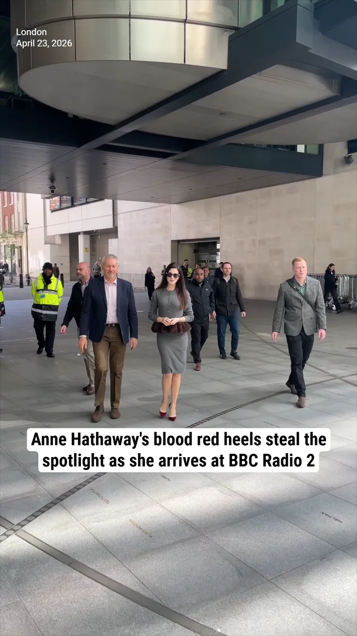 Anne Hathaway's blood red heels steal the spotlight as she arrives at BBC Radio 2