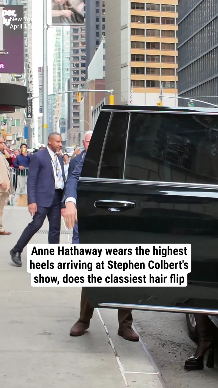 Anne Hathaway wears the highest heels arriving at Stephen Colbert's show, does the classiest hair flip