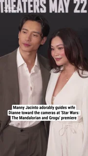 Manny Jacinto adorably guides wife Dianne Doan toward the cameras at 'Star Wars: The Mandalorian and Grogu' premiere