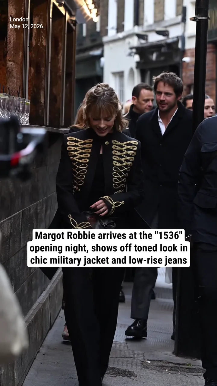 Margot Robbie arrives at the "1536" opening night, shows off toned look in chic military jacket and low-rise jeans