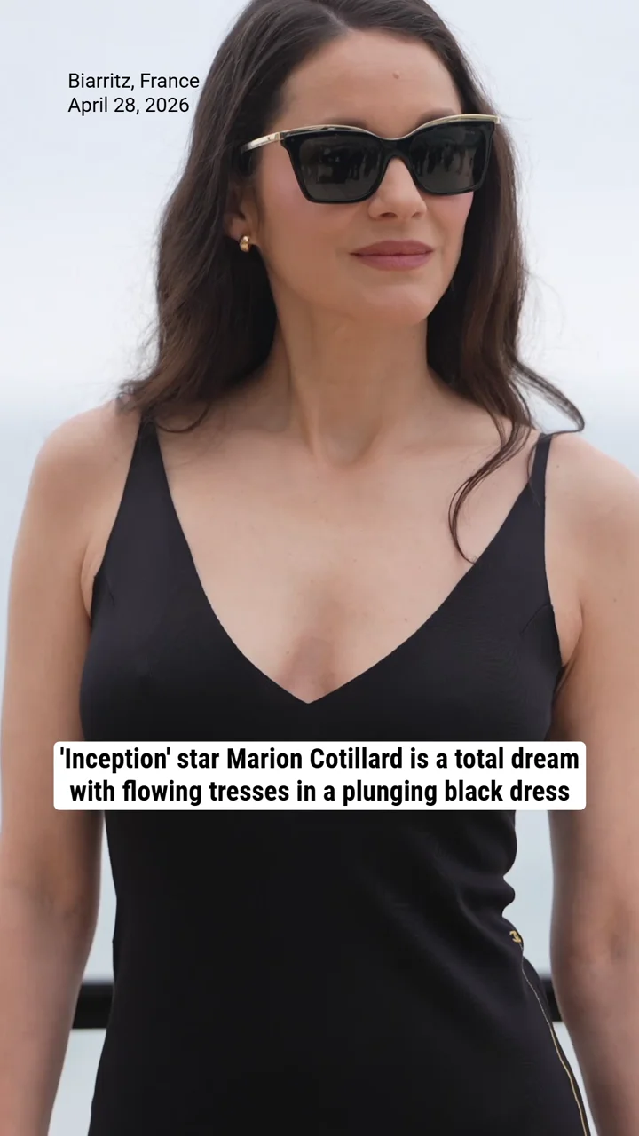 'Inception' star Marion Cotillard is a total dream with flowing tresses in a plunging black dress