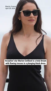 'Inception' star Marion Cotillard is a total dream with flowing tresses in a plunging black dress