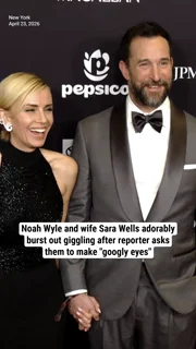 Noah Wyle and wife Sara Wells adorably burst out giggling after reporter asks them to make "googly eyes"