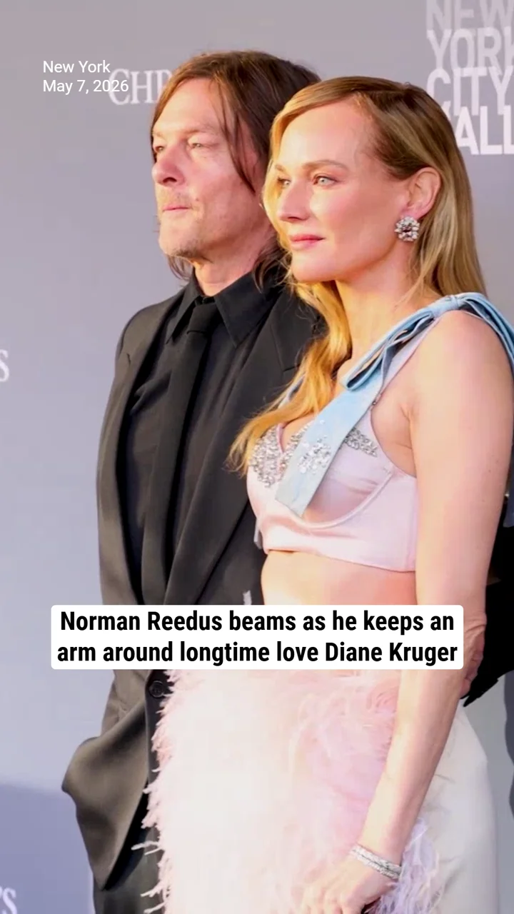 Norman Reedus beams as he keeps an arm around longtime love Diane Kruger