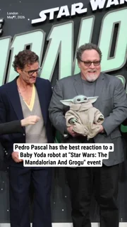 Pedro Pascal has the best reaction to a Baby Yoda robot at "Star Wars: The Mandalorian And Grogu" event