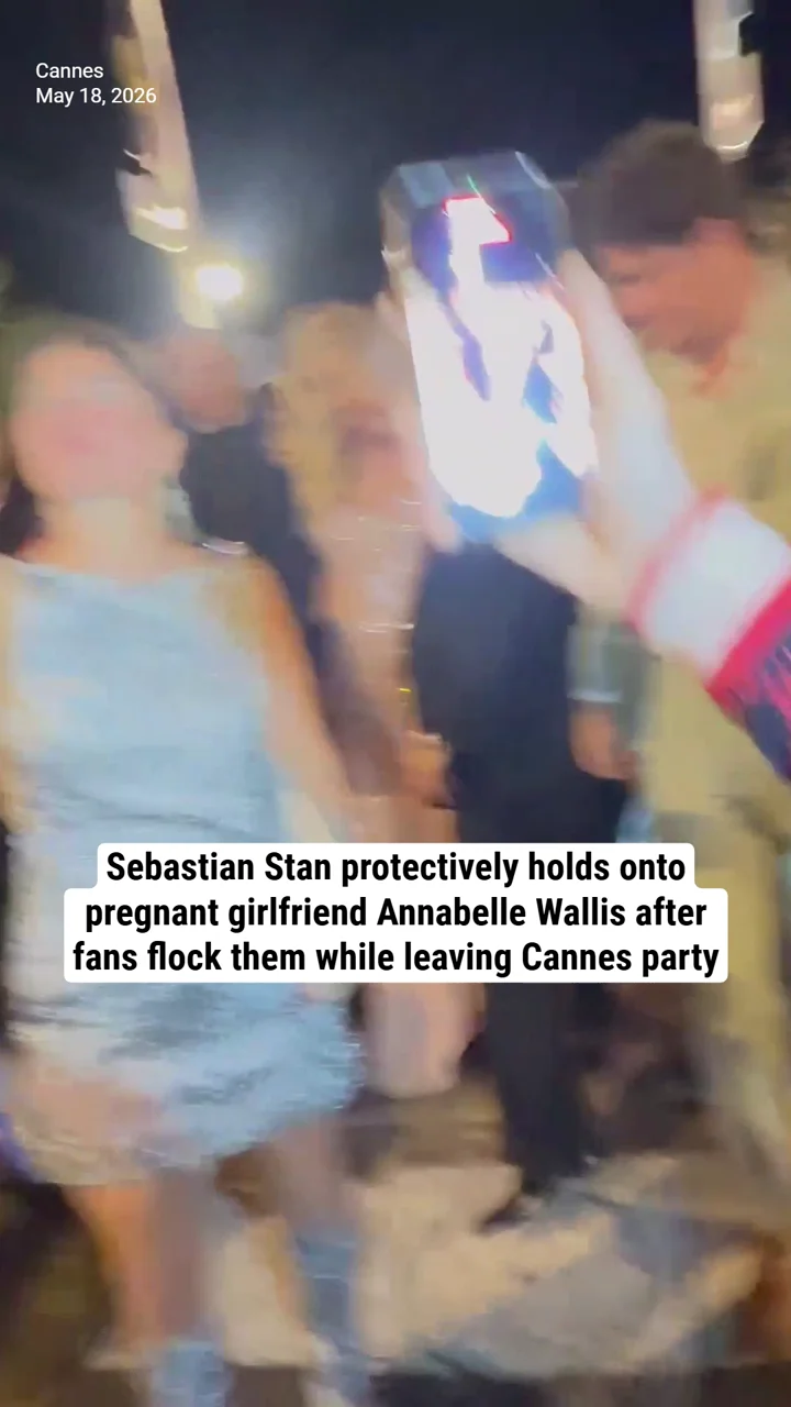 Sebastian Stan protectively holds onto pregnant girlfriend Annabelle Wallis after fans flock them while leaving Cannes party