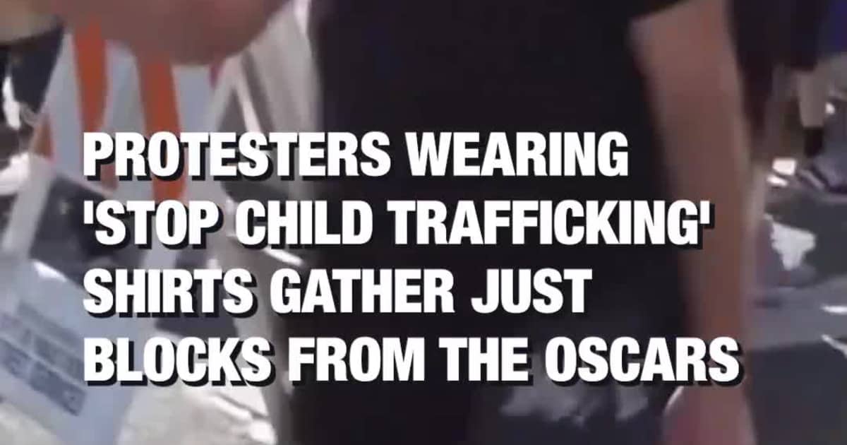 Protesters wearing 'Stop child trafficking' shirts gather just blocks from the Oscars