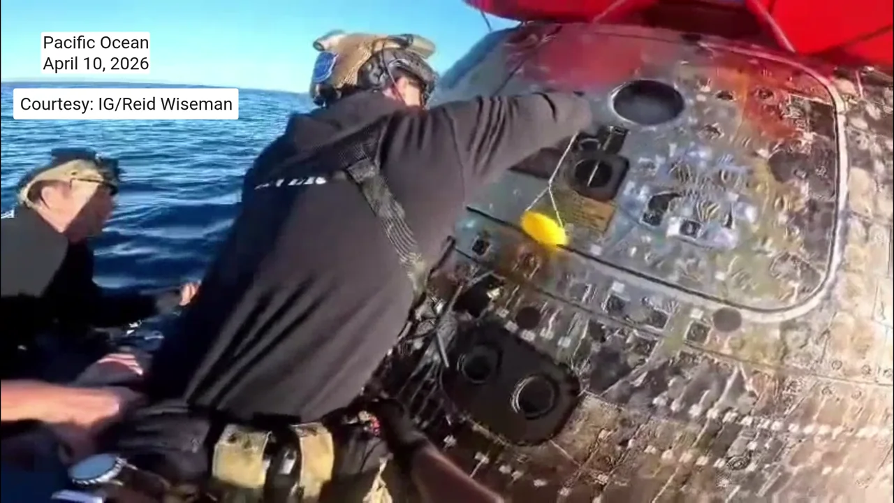 Rare footage shows Artemis II astronauts welcoming recovery team aboard Integrity moments after splashdown